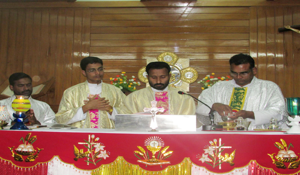 father offering prayer in saint josef church sirohi